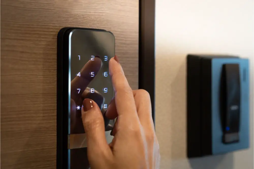 woman's finger entering password code on the smart digital touch screen keypad
